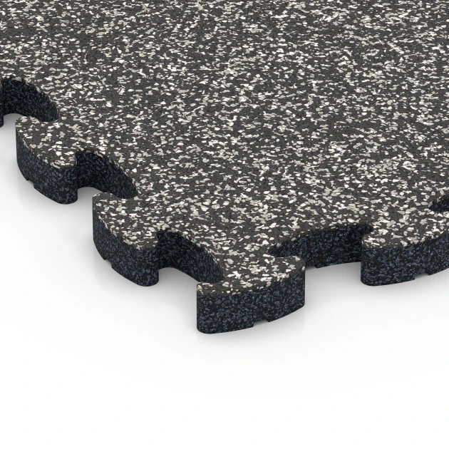 Detailaufnahme der Randausprägung von WARCO-Produkt 6931, Pavimentazione antitrauma puzzle, Format 44,6 x 44,6 × 2,8 cm, Farbe Granito grigio scuro.