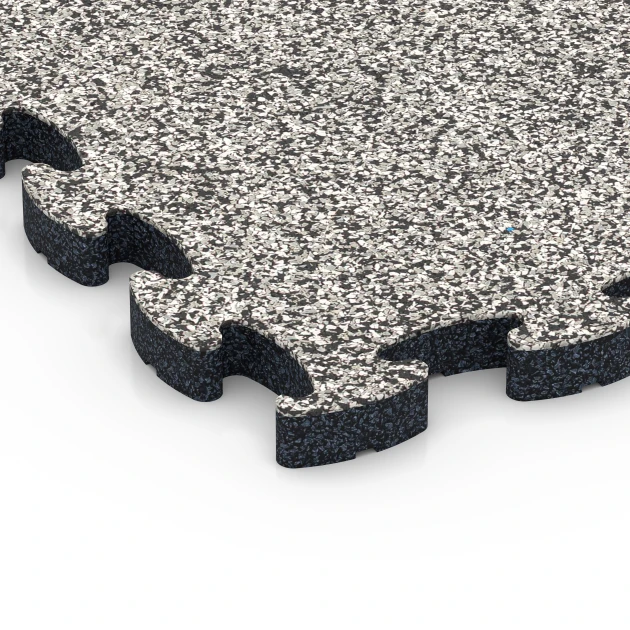 Detailaufnahme der Randausprägung von WARCO-Produkt 6932, Pavimentazione antitrauma puzzle, Format 44,6 x 44,6 × 2,8 cm, Farbe Granito grigio.