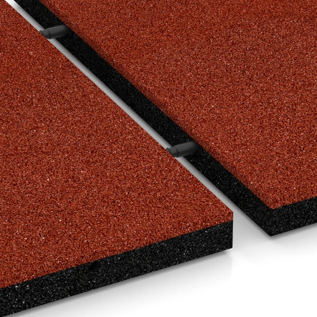 Le gros plan sur le système de connexion des revêtements de sol WARCO 6194 - Dalles amortissantes en couleur Rouge brique. Les dimensions 50 x 50 x 4 cm.