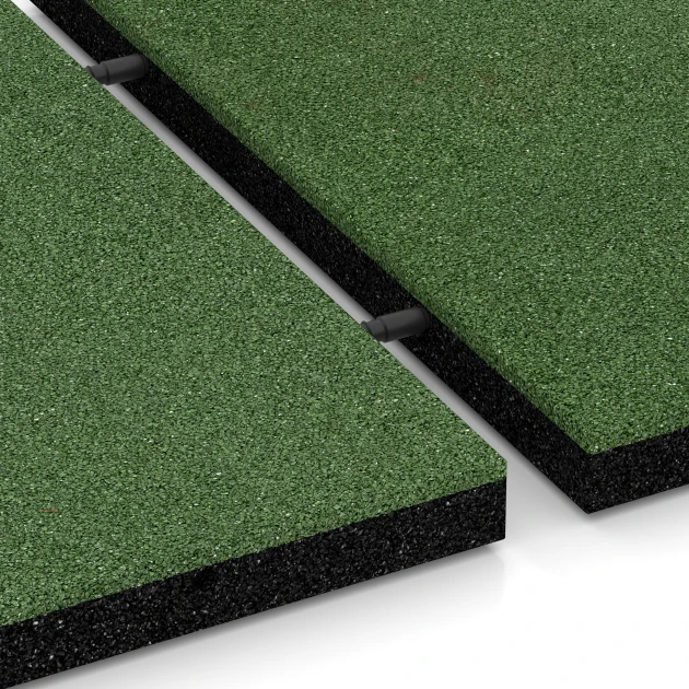 Le gros plan sur le système de connexion des revêtements de sol WARCO 6195 - Dalles amortissantes en couleur Vert herbe. Les dimensions 50 x 50 x 4 cm.